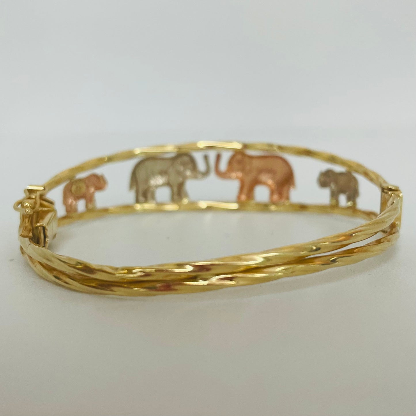 Jonc en 3 ors motif éléphants 18K 5,5cm