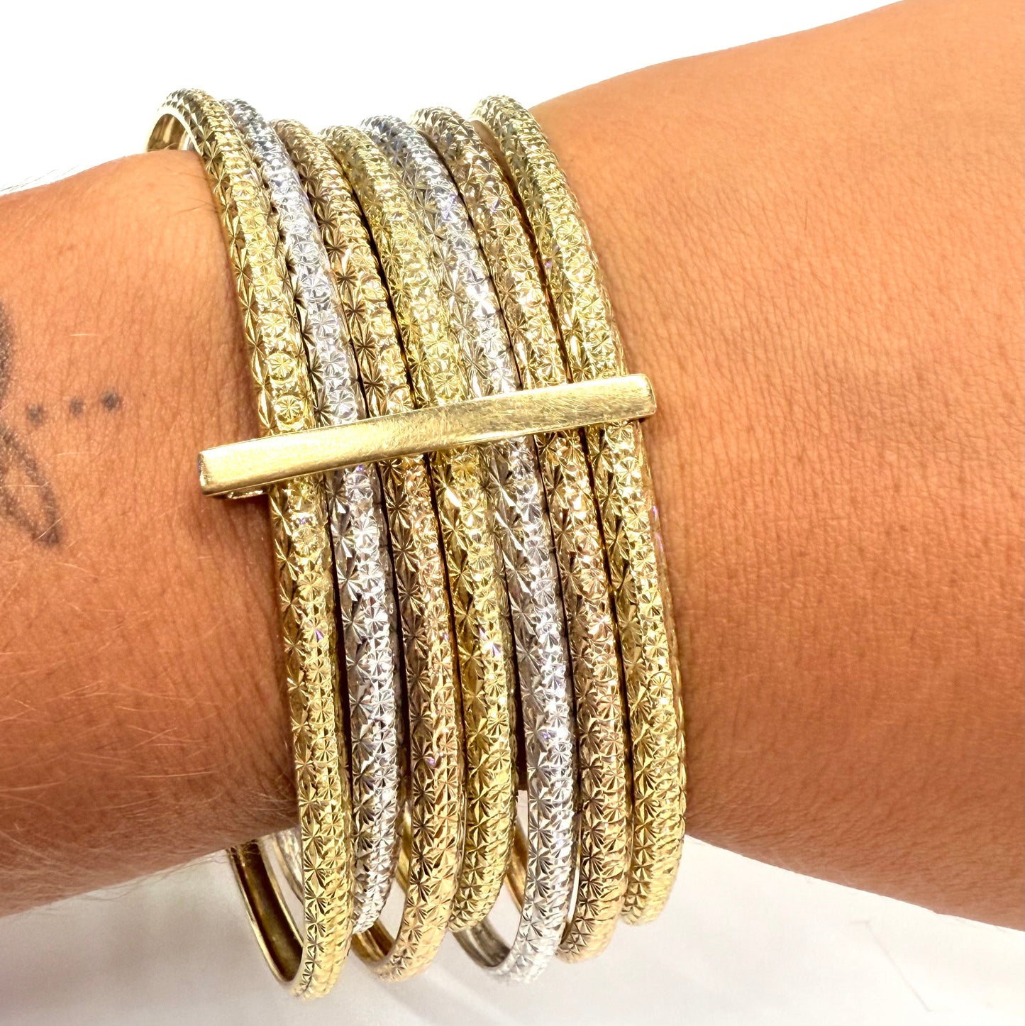 Bracelet Semainier 7 joncs en 3 ors 18 carats - 57.92 Grs