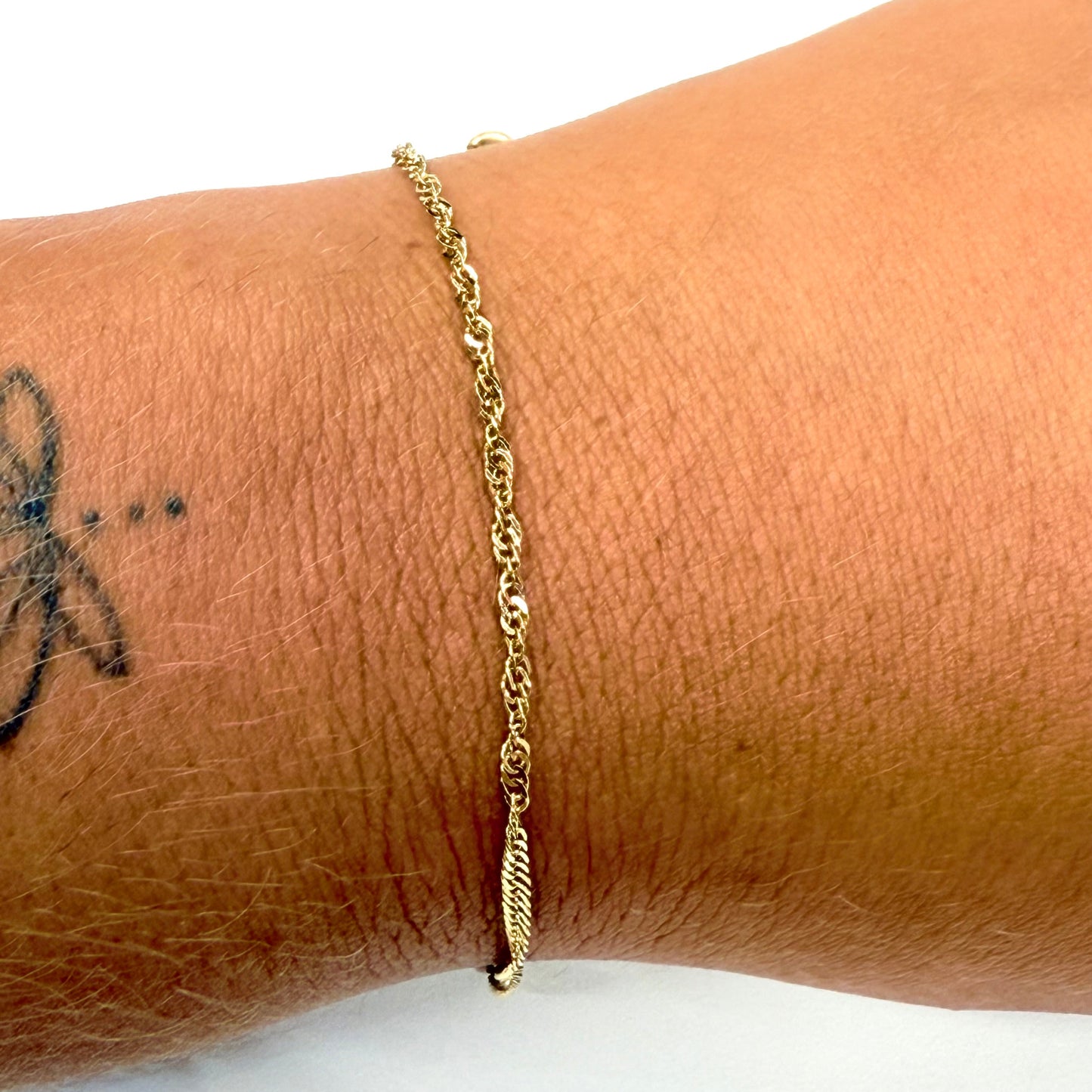 Bracelet torsadé en or jaune 18K - 1.25 Grs