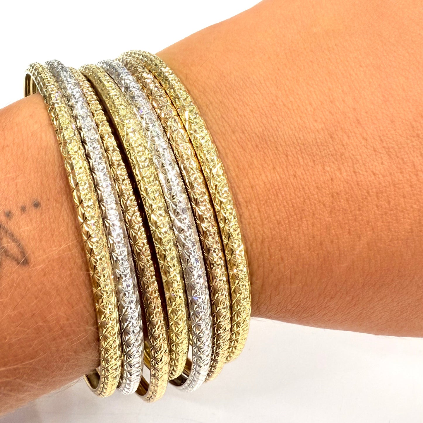 Bracelet Semainier 7 joncs en 3 ors 18 carats - 57.92 Grs